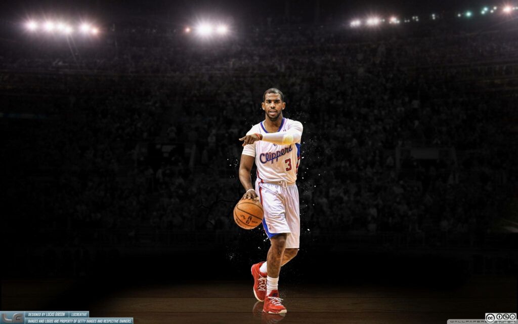 Chris Paul leading Los Angeles Clippers in intense spotlight basketball court wallpaper background