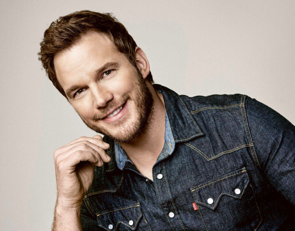 Chris Pratt smiling warmly in classic denim shirt with soft background high-resolution wallpaper