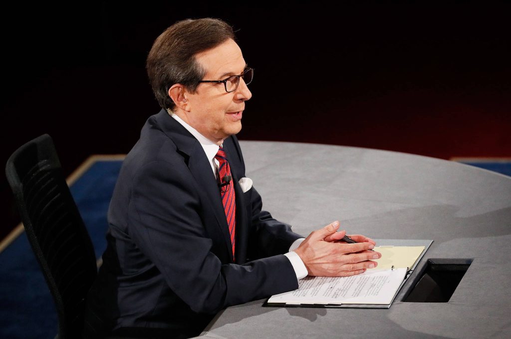 Chris Wallace in sharp suit at debate desk dark studio background professional news wallpaper
