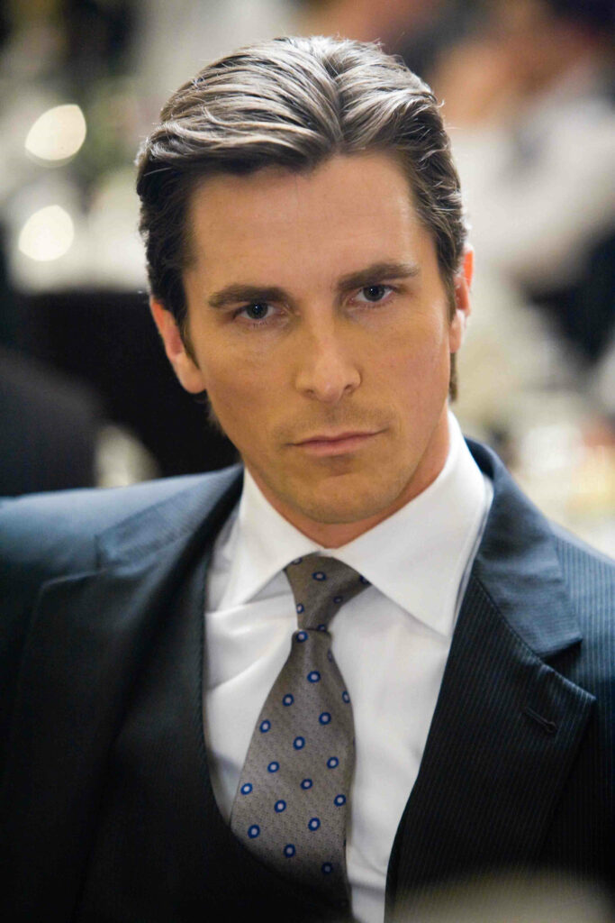 Christian Bale in classic suit exuding confident style wallpaper for sophisticated fans