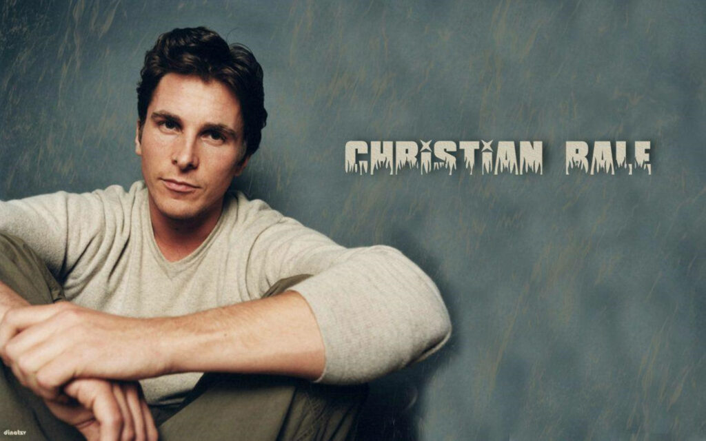 Christian Bale fan art wallpaper relaxed pose textured background bold icy name text