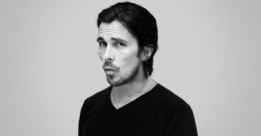 Christian Bale grayscale wallpaper confident pose expressive features charismatic presence