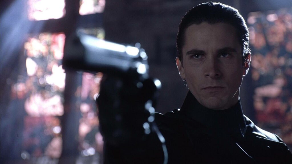 Christian Bale tense pose with gun in Equilibrium 2002 dramatic action movie wallpaper background