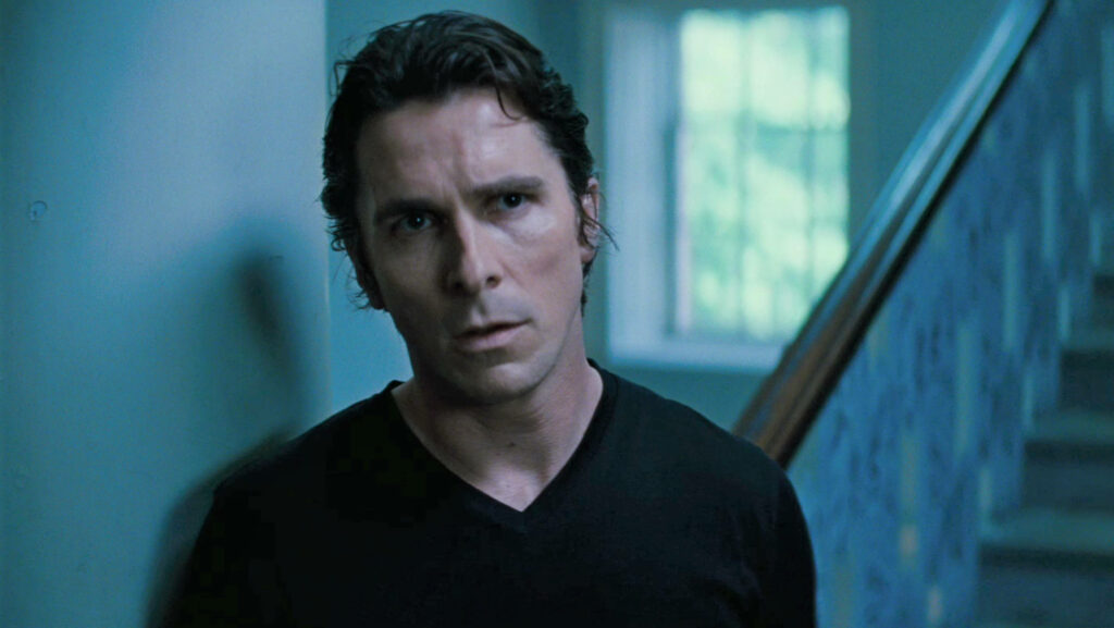 Christian Bale intense serious expression indoor scene from The Dark Knight Rises wallpaper background