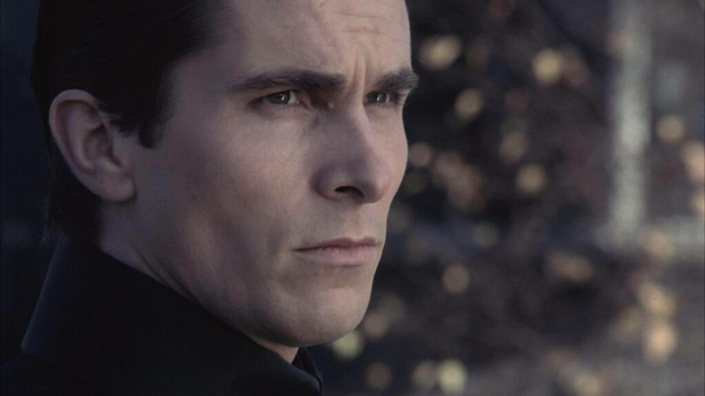 Christian Bale as Bruce Wayne intense close-up wallpaper capturing dramatic determined expression