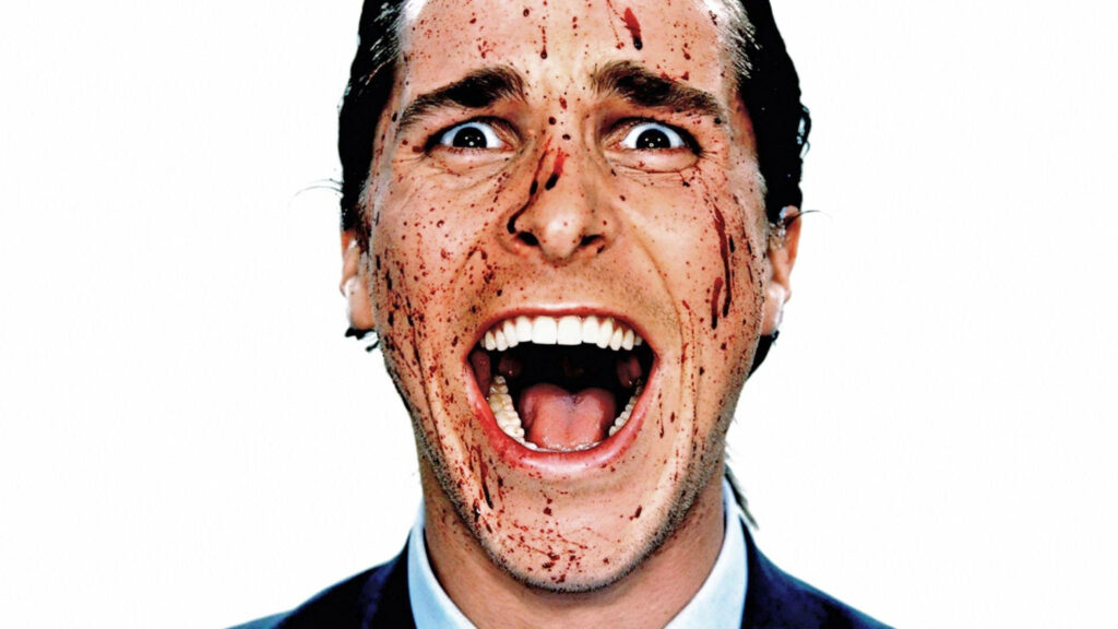 Christian Bale as Patrick Bateman American Psycho close-up blood splattered face intense expression Wallpaper