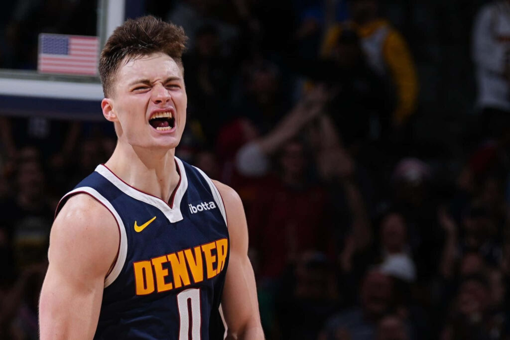 Christian Braun Denver basketball player shouting in celebration with vibrant court energy wallpaper