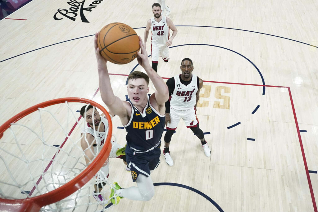 Christian Braun Denver Nuggets mid-air layup basketball game intense action Miami Heat defense Wallpaper
