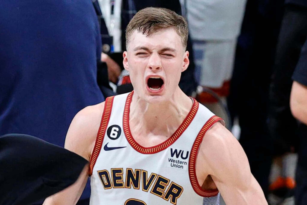 Christian Braun Denver Nuggets celebrating intense basketball moment vibrant energy wallpaper