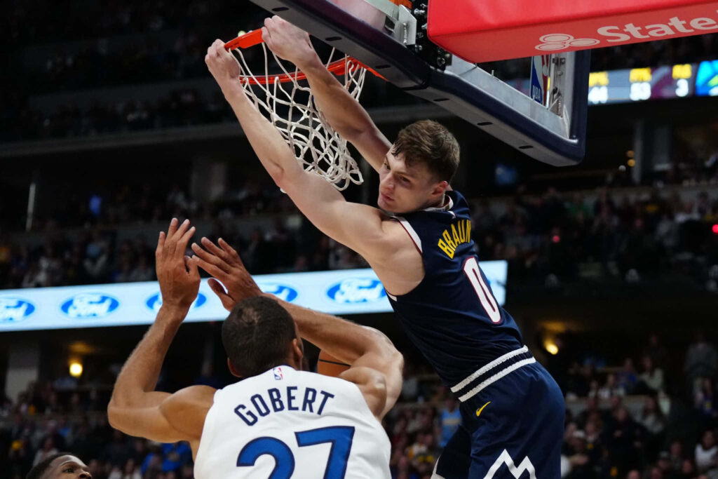 Christian Braun Denver Nuggets dunk over Rudy Gobert Minnesota Timberwolves intense NBA action Wallpaper