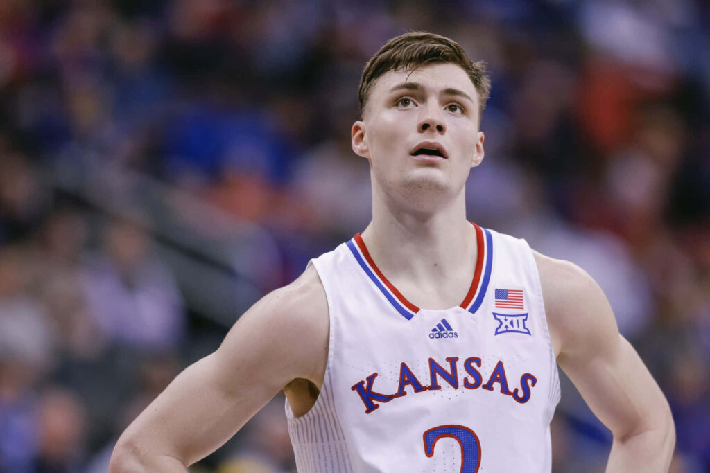 Christian Braun Kansas Basketball player in white blue jersey focused during game action wallpaper