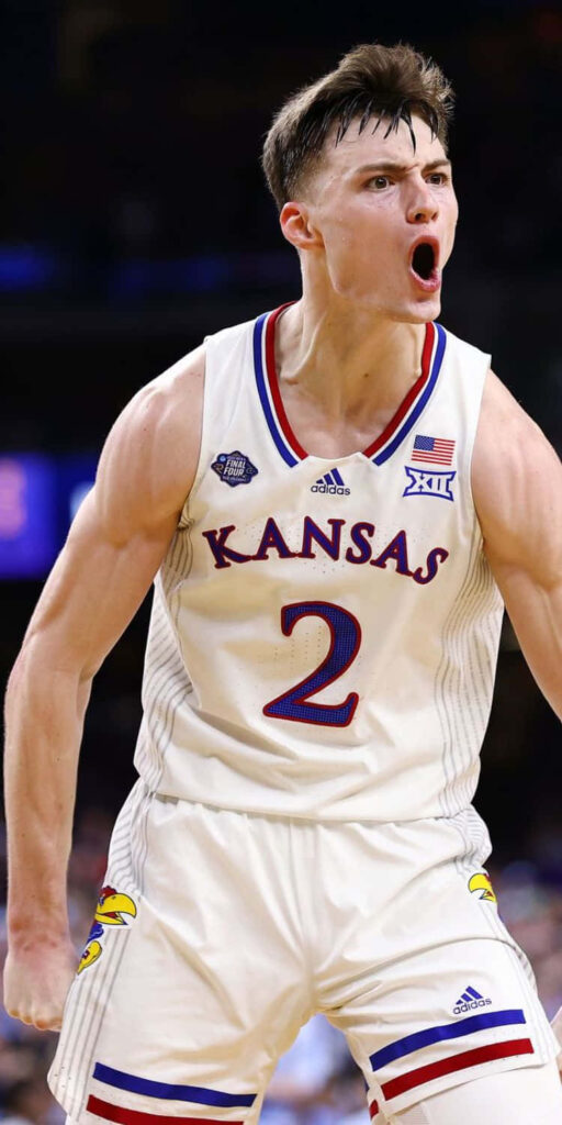 Christian Braun Kansas Basketball intense celebration vibrant team colors dynamic sports action wallpaper