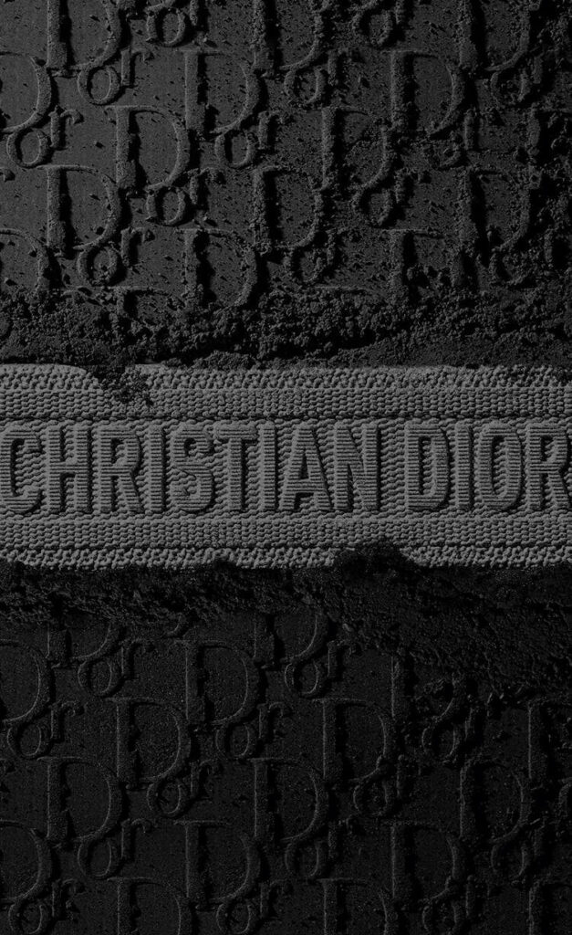Christian Dior logo embossed on black textured background with bold gray designer name band Wallpaper