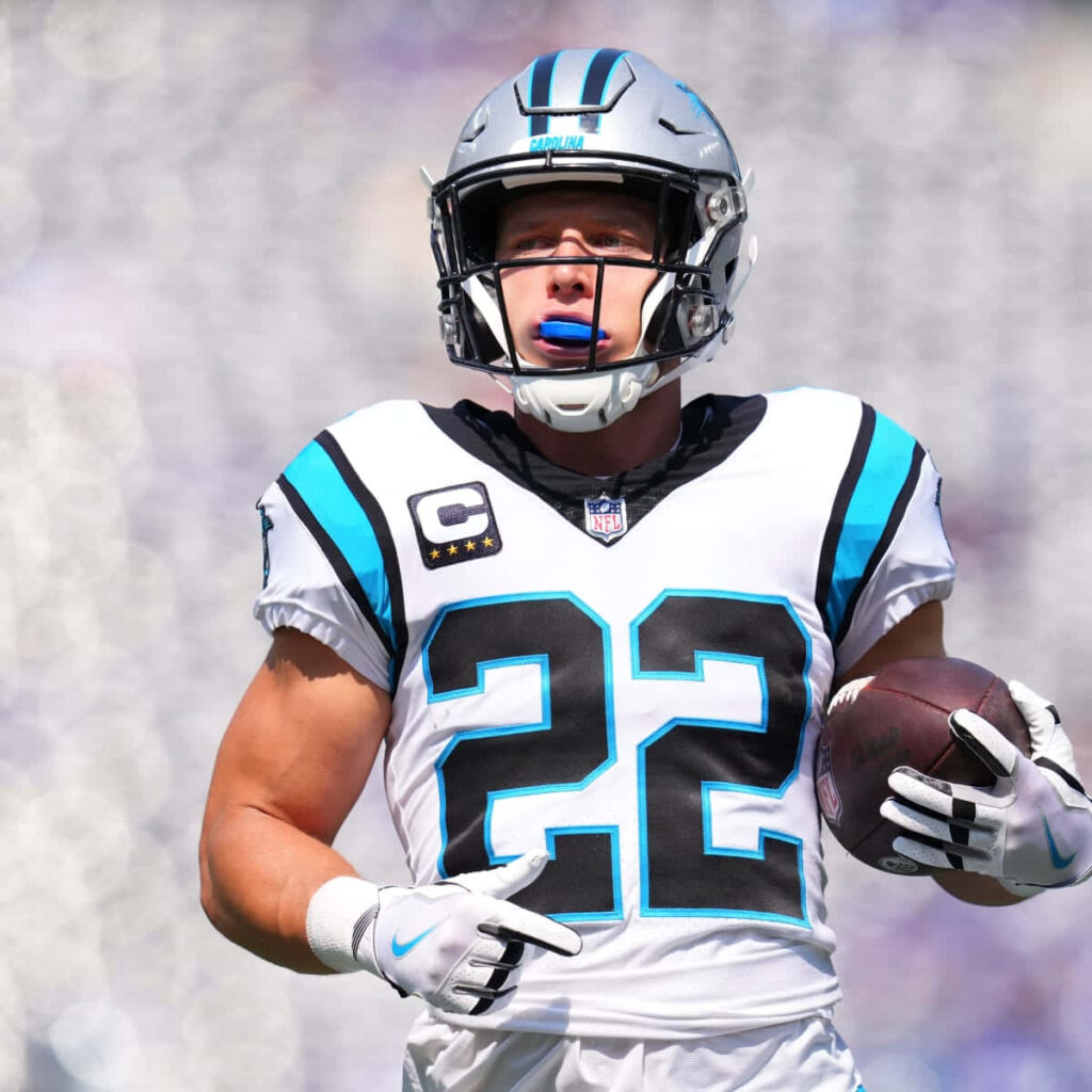 Christian McCaffrey Carolina Panthers No 22 jersey intense focus dynamic football wallpaper background