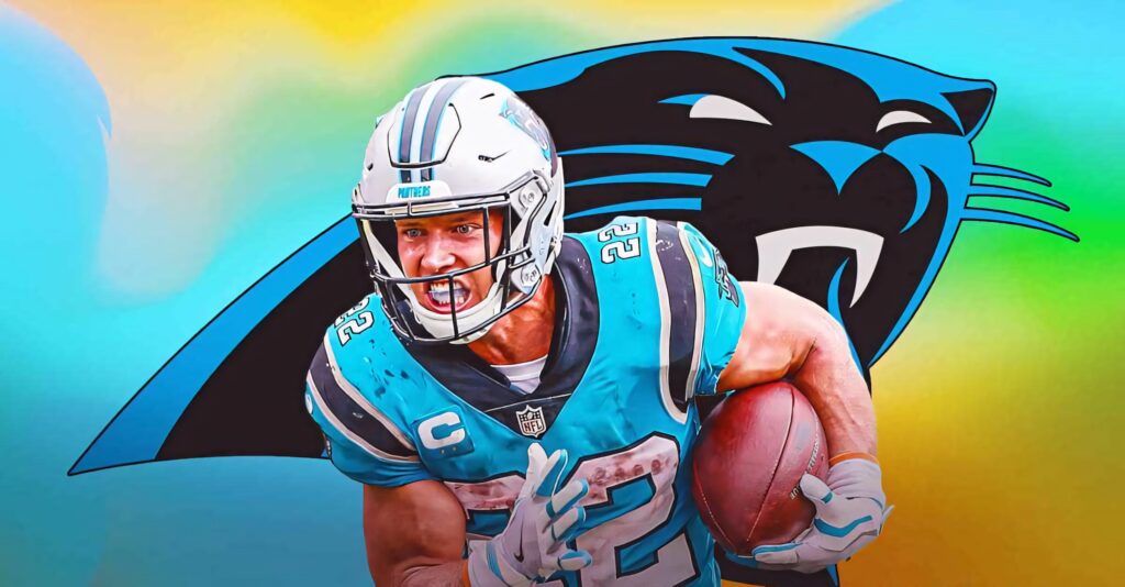 Christian McCaffrey in Carolina Panthers uniform charging football dynamic NFL star wallpaper