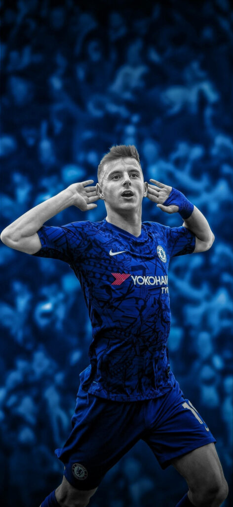 Christian Pulisic celebrating in Chelsea FC kit with blue background showcasing football energy Wallpaper