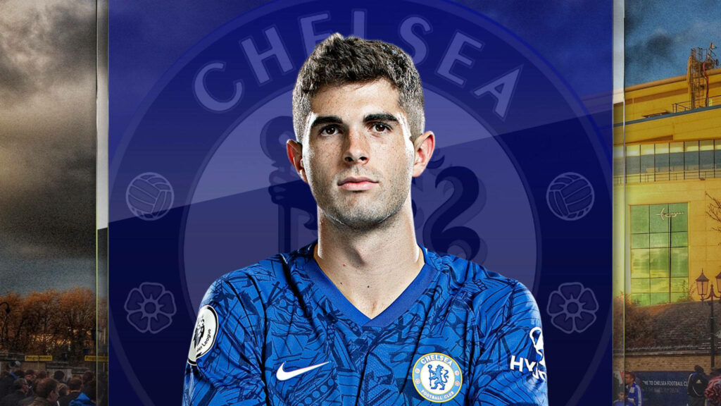 Christian Pulisic in Chelsea kit with vibrant blue Chelsea FC crest wallpaper background