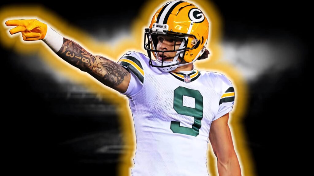 Christian Watson Green Bay Packers number 9 jersey confident pose with bold yellow green background Wallpaper