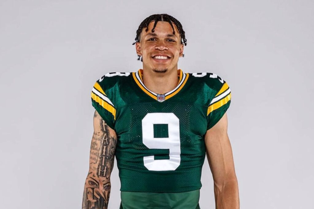 Christian Watson Green Bay Packers NFL wide receiver number 9 in team uniform wallpaper background