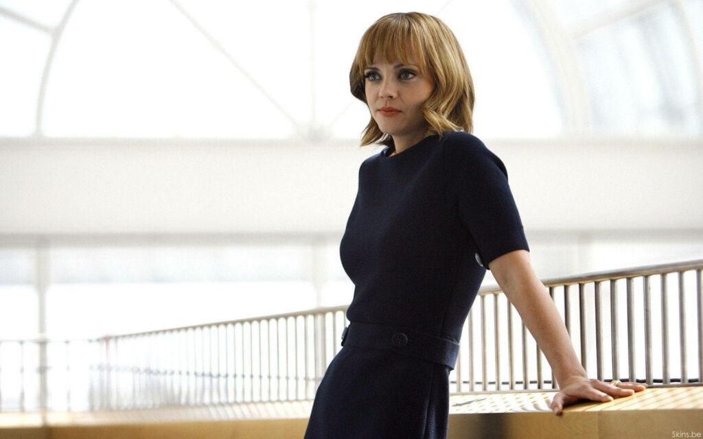 Christina Ricci blonde elegant pose dark outfit modern railing soft natural lighting wallpaper