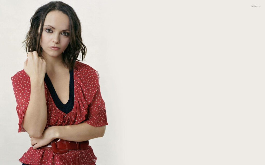 Christina Ricci in red polka dot blouse with matching belt stylish modern wallpaper background