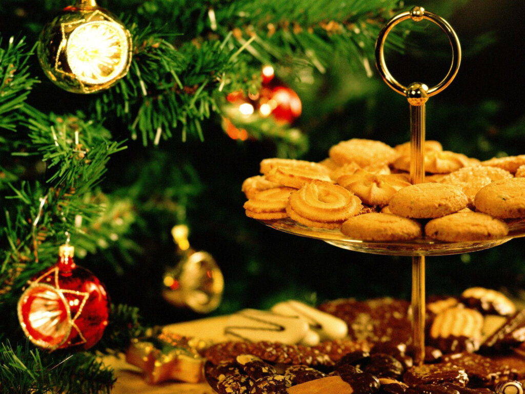 Festive Delights: Exquisite Christmas Cookies and Ornamented Tree Wallpaper