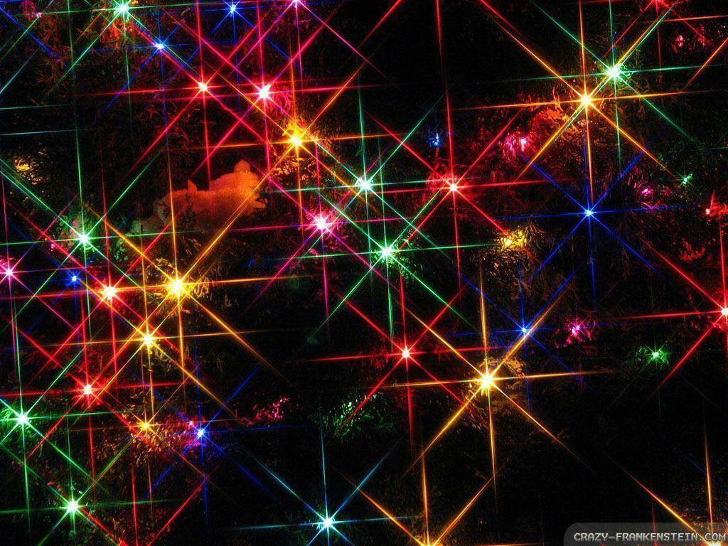 Radiant Festive Delight: Vibrant Christmas Lights Adorning a Majestic Tree Wallpaper