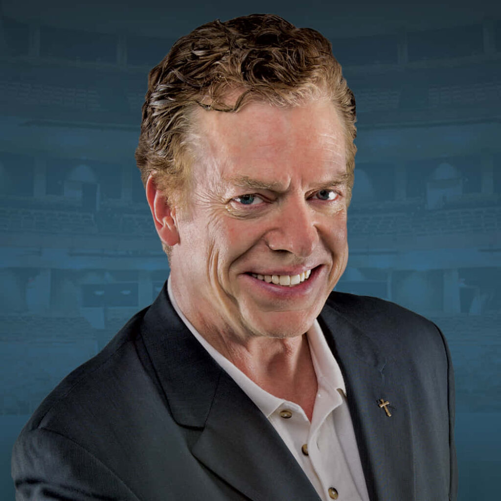 Christopher McDonald in sharp suit confident smile soft blurred cool-toned background wallpaper