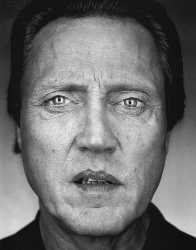 Greyscale portrait of Christopher Walken with intense gaze and detailed textures wallpaper background