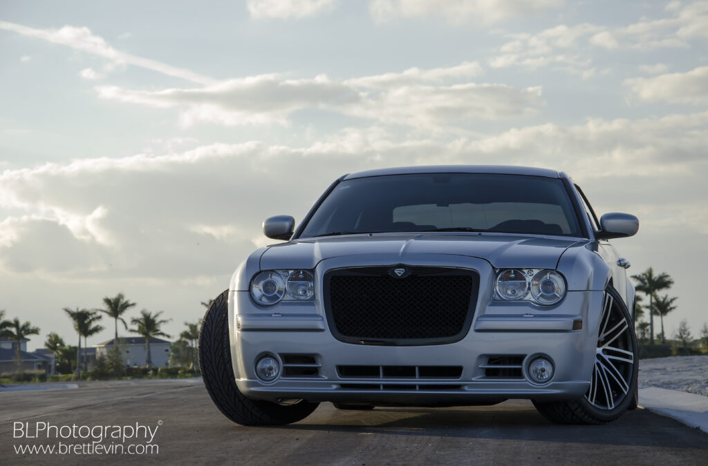 Chrysler 300C SRT8 Front View: Sleek Design in Scenic Background Wallpaper