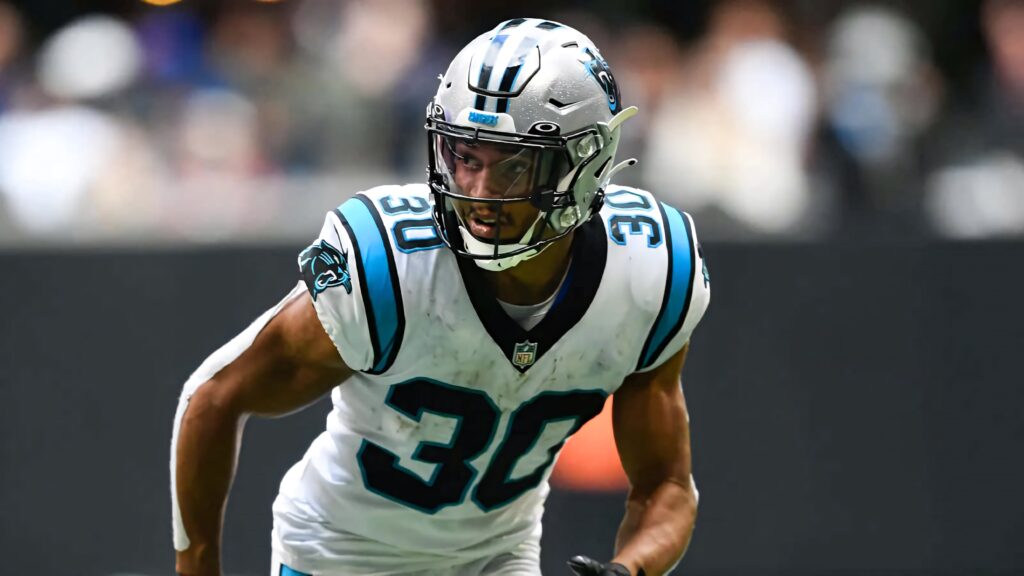 Chuba Hubbard in Carolina Panthers uniform focused in action dynamic football athletic wallpaper