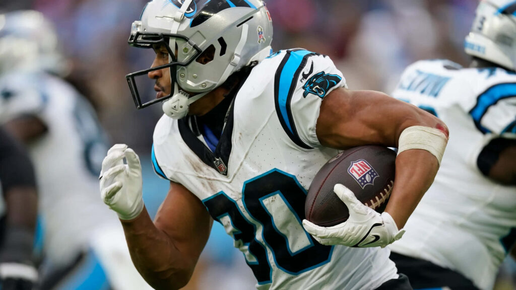 Carolina Panthers running back Chuba Hubbard in action showing athleticism and focus wallpaper