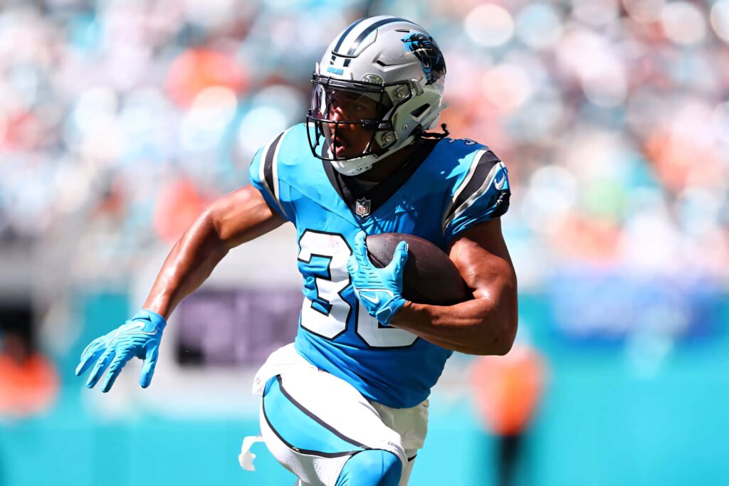 Chuba Hubbard sprinting in Carolina Panthers uniform football wallpaper showing speed and focus
