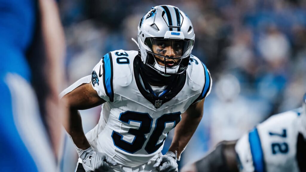 Chuba Hubbard Carolina Panthers number 30 intense action football field blue silver uniform wallpaper