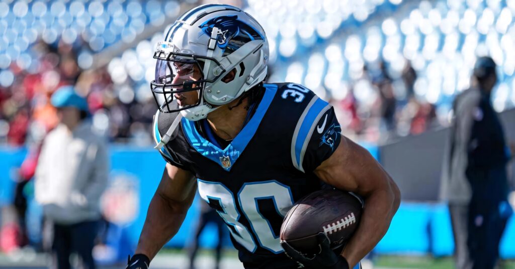Chuba Hubbard Carolina Panthers action shot dynamic football wallpaper black blue silver colors