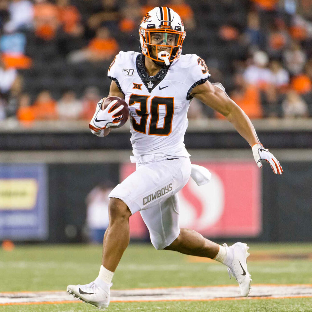 Chuba Hubbard running back in white Oklahoma State Cowboys uniform dynamic football wallpaper