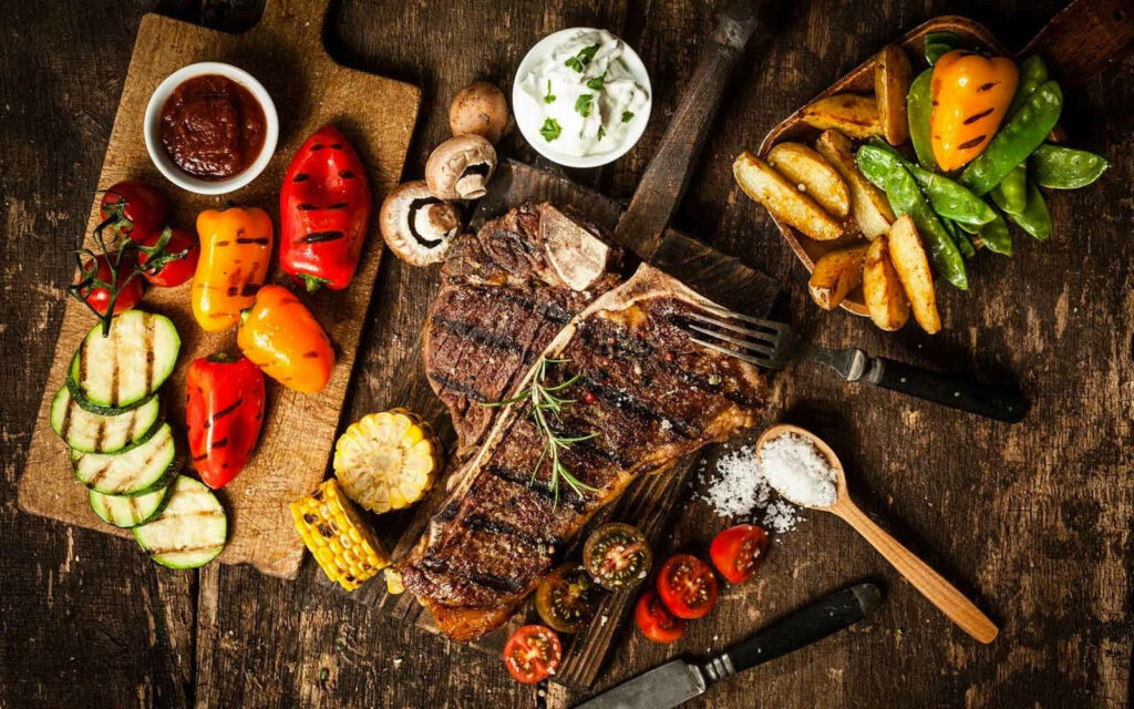 Stunning Churrasco Meat Dish with Grilled Veggies - Rustic Wallpaper