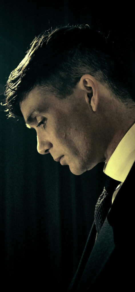 Cillian Murphy intense portrait wallpaper moody lighting dramatic dark background contemplative pose