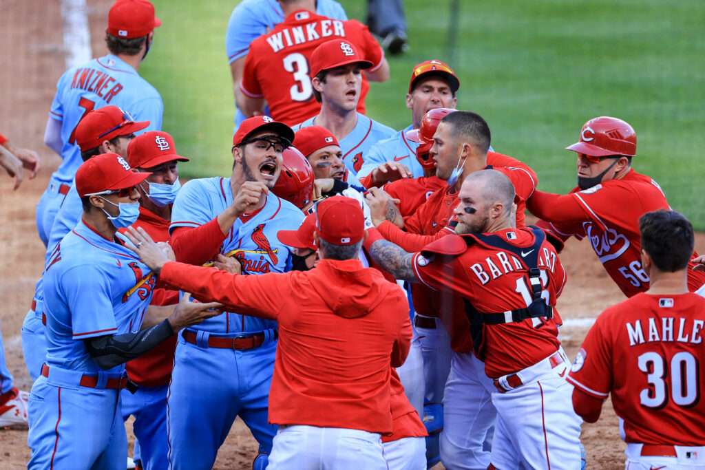 Cincinnati Reds and St Louis Cardinals players confront in intense MLB rivalry baseball game wallpaper