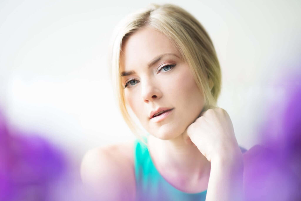 Cindy Busby serene portrait in soft natural light with pastel blurred background wallpaper