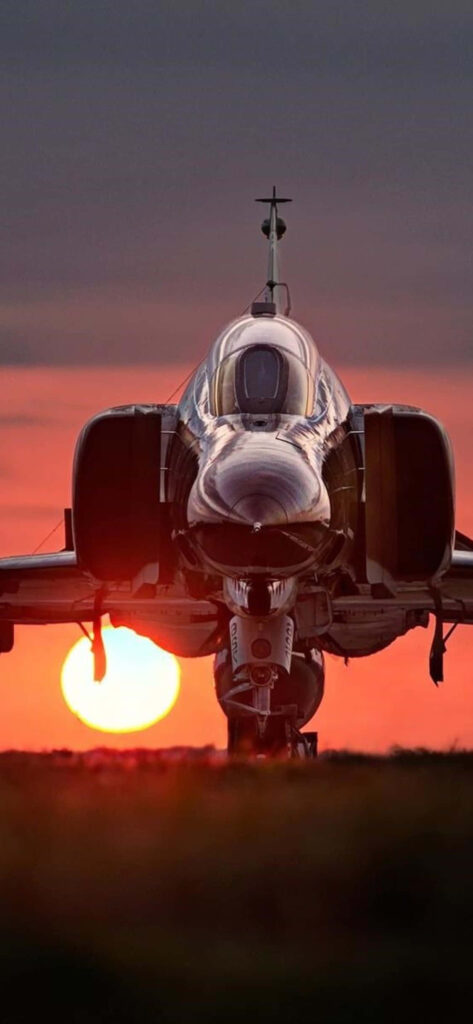 Spectacular Sunset Landing: Marvelous McDonnell Douglas F-4 Phantom II Touches Down Wallpaper