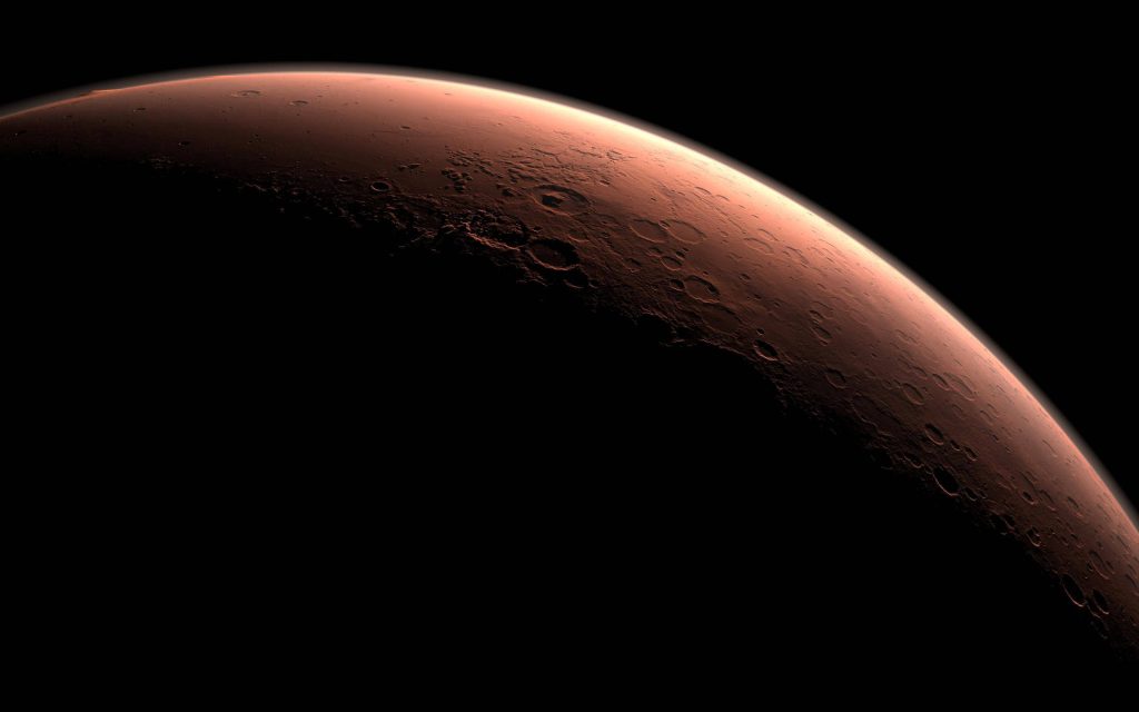 Crescent Mars digital wallpaper showing cratered rust-red surface against dark space background