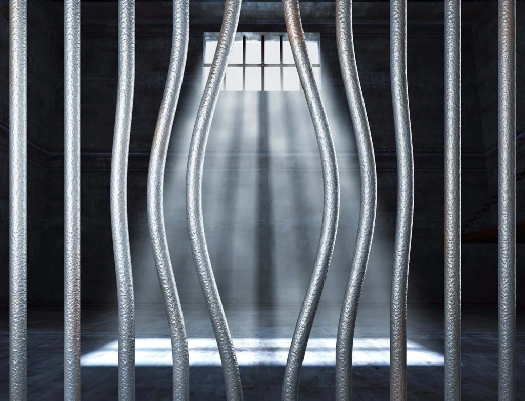 Cinematic CGI prison cell with bent bars bright light casting shadows dark intense wallpaper background