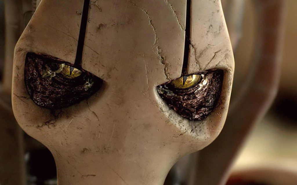 Close-up of General Grievous with reptilian yellow eyes and cracked armor Star Wars wallpaper