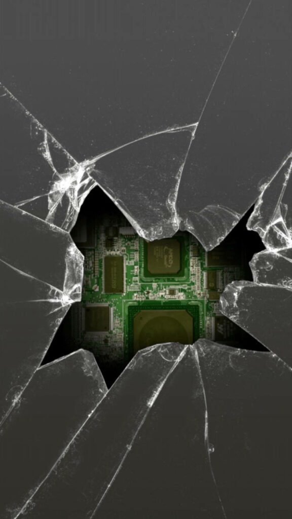 Chaos in Design: Unveiling the Intricate Circuitry Beneath a Cracked Phone Screen Wallpaper