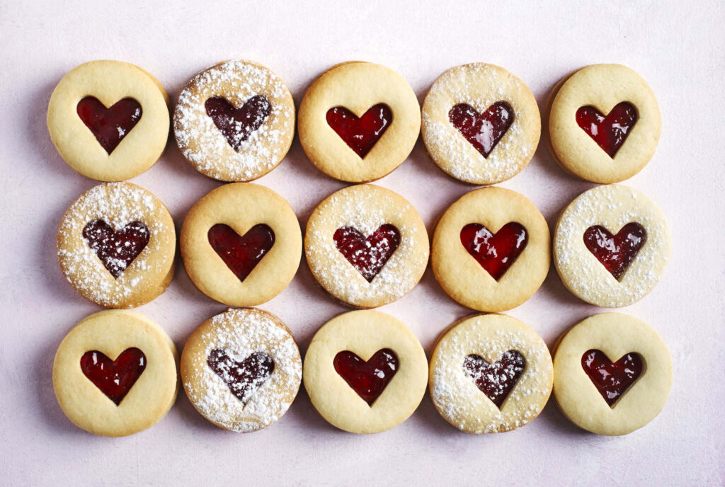 Sweet Love Delight: A Tempting Valentine's Day Treat with Heart-Filled Cookie Goodness Wallpaper