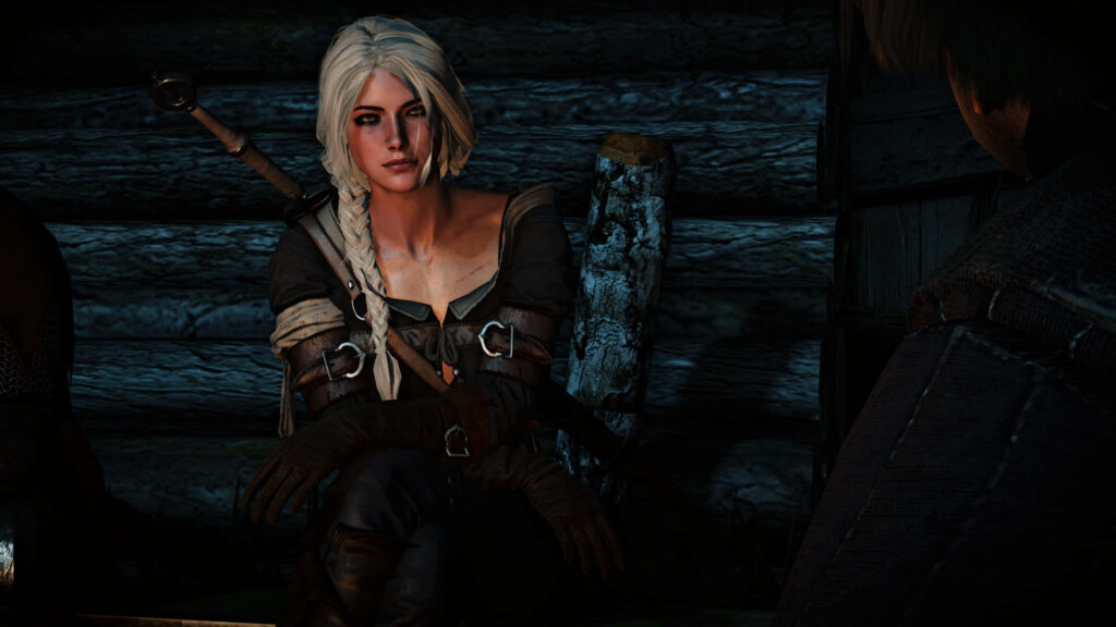Ciri from The Witcher sits confidently in dim rustic cabin with white braided hair and strong gaze Wallpaper