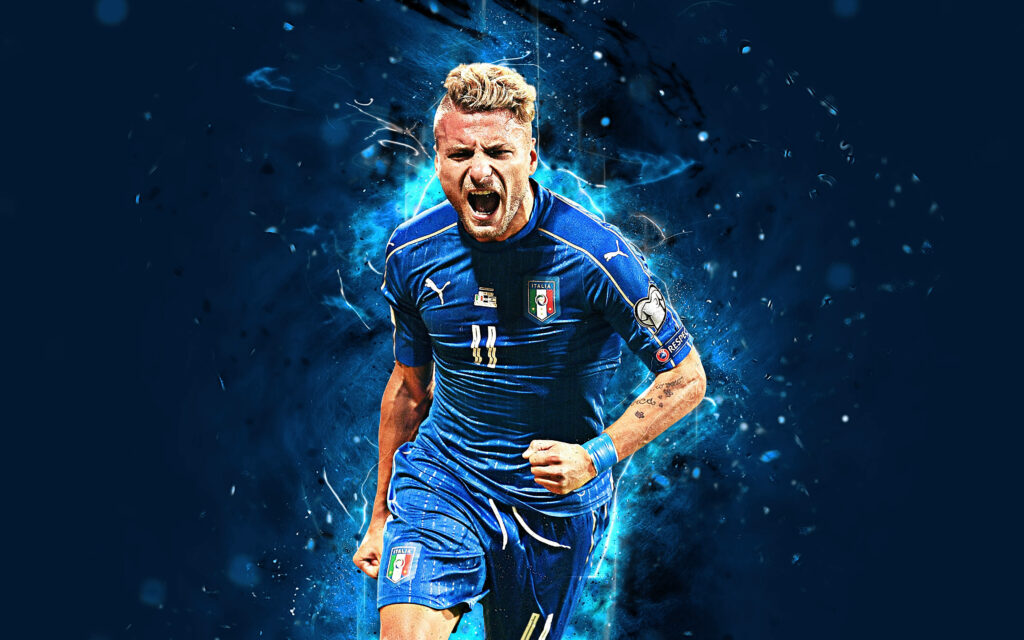 Ciro Immobile in Italy blue football kit with vibrant blue energy effect digital art wallpaper