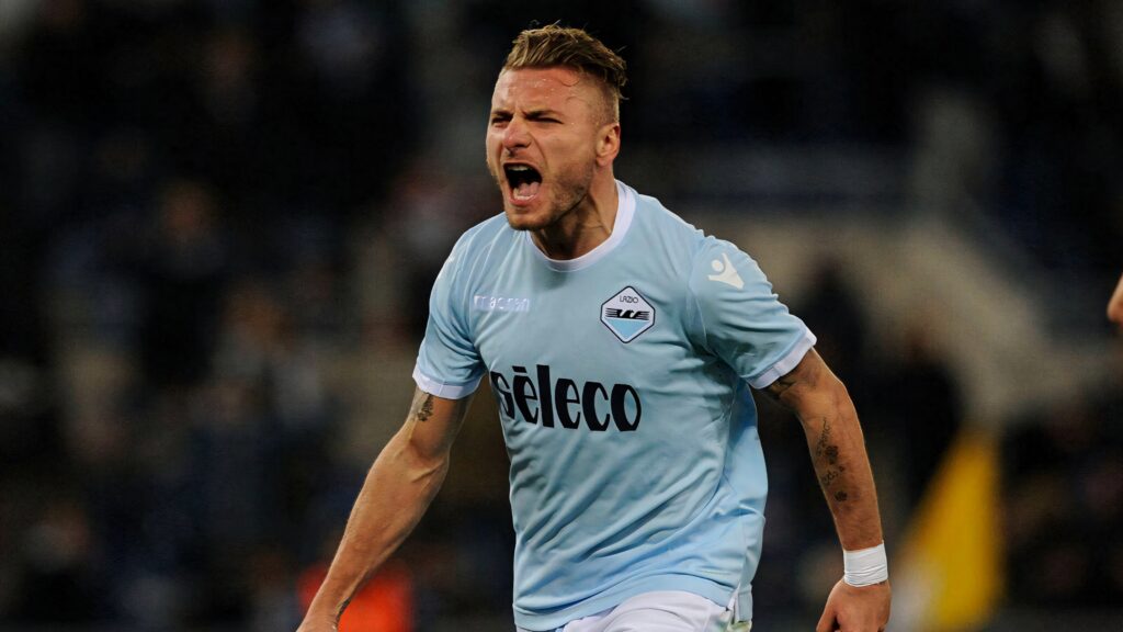 Ciro Immobile in Lazio kit showing intense focus and energy during dynamic football match action Wallpaper