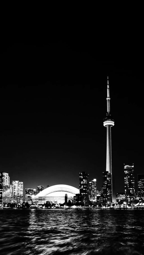 Serene Metropolis: Cityscape Reflections on a Dark Lake Wallpaper